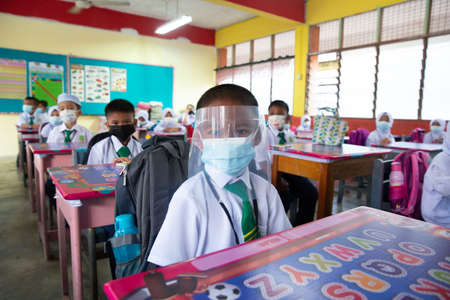Alor Setar Kedah,Malaysia-March 1,2021:The first day of the school session for preschool students in Alor Setar during the Covid-19 pandemic season is hitting the world.のeditorial素材