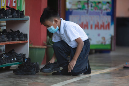 Alor Setar Kedah,Malaysia-March 1,2021:The first day of the school session for preschool students in Alor Setar during the Covid-19 pandemic season is hitting the world.のeditorial素材