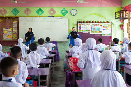 Alor Setar Kedah,Malaysia-March 1,2021:The first day of the school session for preschool students in Alor Setar during the Covid-19 pandemic season is hitting the world.のeditorial素材