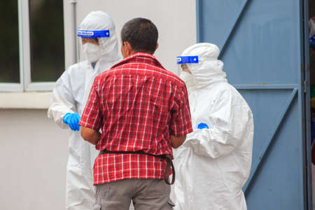 Alor Setar, Kedah, Malaysia - May 20, 2021 : Private clinic make a Swab test in  to local citizen due to Covid-19 positive cases raised up. Selective focus image with noise effectのeditorial素材
