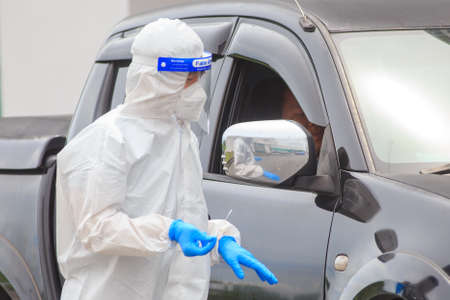 Alor Setar, Kedah, Malaysia - May 20, 2021 : Private clinic make a Swab test in  to local citizen due to Covid-19 positive cases raised up. Selective focus image with noise effectのeditorial素材