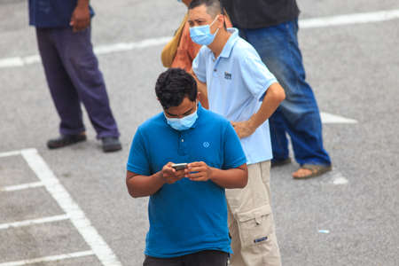 Alor Setar, Kedah, Malaysia - May 20, 2021 : Private clinic make a Swab test in  to local citizen due to Covid-19 positive cases raised up. Selective focus image with noise effectのeditorial素材