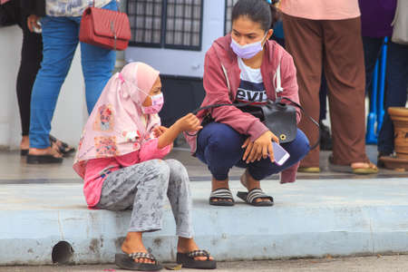 Alor Setar, Kedah, Malaysia - May 20, 2021 : Private clinic make a Swab test in  to local citizen due to Covid-19 positive cases raised up. Selective focus image with noise effectのeditorial素材