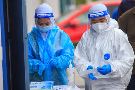 Alor Setar, Kedah, Malaysia - May 20, 2021 : Private clinic make a Swab test in  to local citizen due to Covid-19 positive cases raised up. Selective focus image with noise effectのeditorial素材
