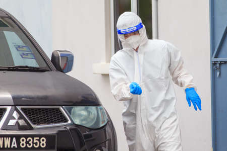 Alor Setar, Kedah, Malaysia - May 20, 2021 : Private clinic make a Swab test in  to local citizen due to Covid-19 positive cases raised up. Selective focus image with noise effectのeditorial素材