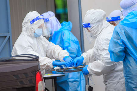Alor Setar, Kedah, Malaysia - May 20, 2021 : Private clinic make a Swab test in  to local citizen due to Covid-19 positive cases raised up. Selective focus image with noise effectのeditorial素材