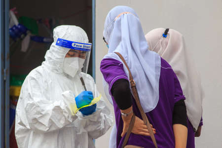 Alor Setar, Kedah, Malaysia - May 20, 2021 : Private clinic make a Swab test in  to local citizen...