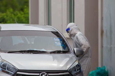 Alor Setar, Kedah, Malaysia - May 20, 2021 : Private clinic make a Swab test in  to local citizen due to Covid-19 positive cases raised up. Selective focus image with noise effectのeditorial素材
