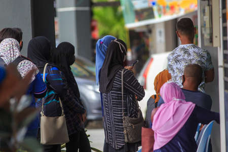 Alor Setar, Kedah, Malaysia - May 20, 2021 : Private clinic make a Swab test in  to local citizen due to Covid-19 positive cases raised up. Selective focus image with noise effectのeditorial素材