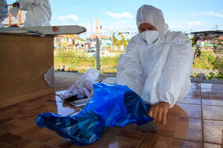 Kuala Lumpur, Malaysia may 2020 - Health workers wearing a PPE suit at graveyard during a funeral for Covid-19 victim in Kuala Lumpur.のeditorial素材