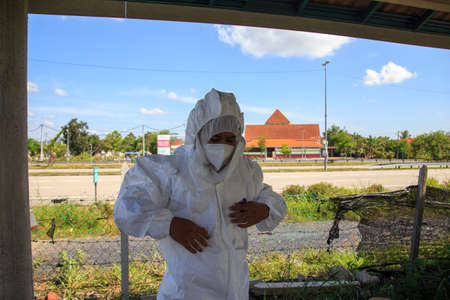 Kuala Lumpur, Malaysia may 2020 - Health workers wearing a PPE suit at graveyard during a funeral for Covid-19 victim in Kuala Lumpur.のeditorial素材