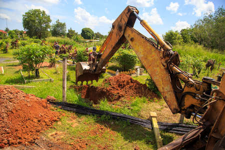 Kuala Lumpur, Malaysia may 2020 - Health workers wearing a PPE suit at graveyard during a funeral for Covid-19 victim in Kuala Lumpur.のeditorial素材