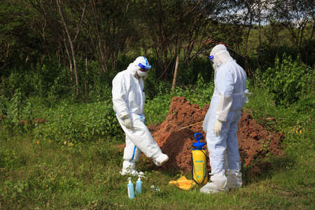 Kuala Lumpur, Malaysia may 2020 - Health workers wearing a PPE suit at graveyard during a funeral for Covid-19 victim in Kuala Lumpur.のeditorial素材