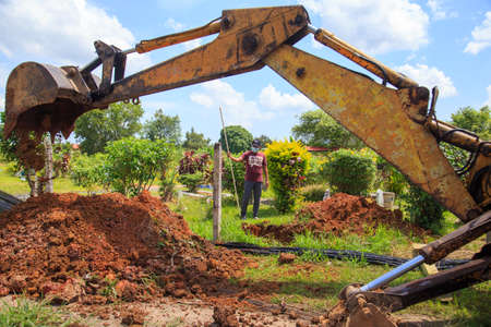 Kuala Lumpur, Malaysia may 2020 - Health workers wearing a PPE suit at graveyard during a funeral for Covid-19 victim in Kuala Lumpur.のeditorial素材
