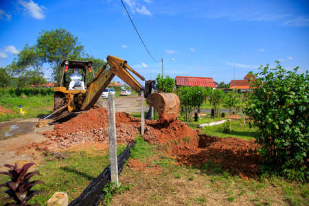 Kuala Lumpur, Malaysia may 2020 - Health workers wearing a PPE suit at graveyard during a funeral for Covid-19 victim in Kuala Lumpur.のeditorial素材