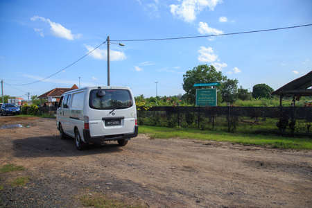 Kuala Lumpur, Malaysia may 2020 - Health workers wearing a PPE suit at graveyard during a funeral for Covid-19 victim in Kuala Lumpur.のeditorial素材