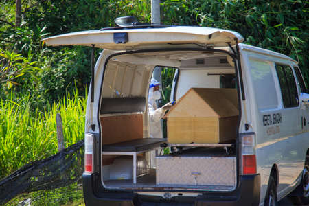Kuala Lumpur, Malaysia may 2020 - Health workers wearing a PPE suit at graveyard during a funeral for Covid-19 victim in Kuala Lumpur.のeditorial素材