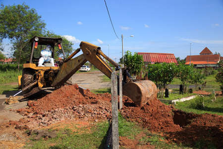 Kuala Lumpur, Malaysia may 2020 - Health workers wearing a PPE suit at graveyard during a funeral for Covid-19 victim in Kuala Lumpur.のeditorial素材