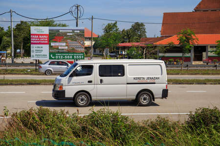 Kuala Lumpur, Malaysia may 2020 - Health workers wearing a PPE suit at graveyard during a funeral for Covid-19 victim in Kuala Lumpur.のeditorial素材