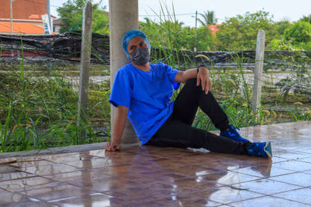 Kuala Lumpur, Malaysia may 2020 - Health workers wearing a PPE suit at graveyard during a funeral for Covid-19 victim in Kuala Lumpur.のeditorial素材