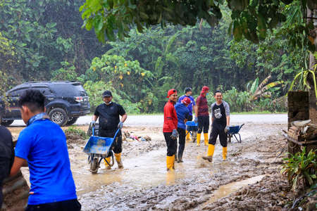 Pahang, Malaysia: January 1, 2022: A group of volunteers help clean the houses of residents affected by the worst floods to hit Malaysia in December 2021のeditorial素材