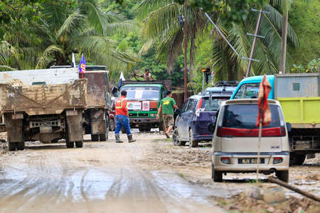 Pahang, Malaysia: January 1, 2022: A group of volunteers help clean the houses of residents affected by the worst floods to hit Malaysia in December 2021のeditorial素材