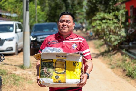 Baling ,Kedah - July 09,2022 : Clean Up Day in Baling,Kedah after aftermath of Baling hit by 'worst ever' floods . Volunteers help clean up flooded areas in Balingのeditorial素材