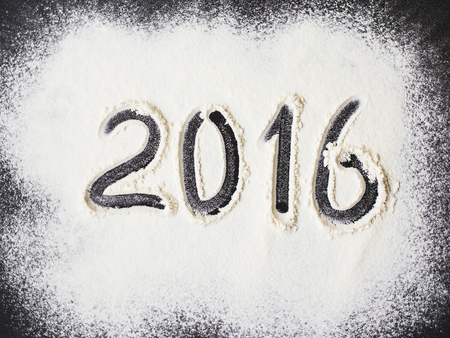 Inscription 2016 to flour on grey stone backgroundの写真素材