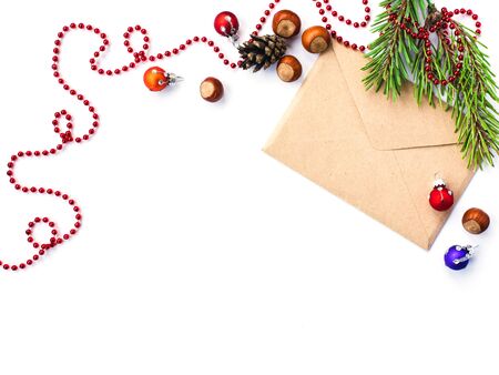 Envelope, cones, hazelnuts  and christmas decorations, isolated on whiteの写真素材