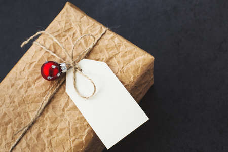 Vintage gift box with Christmas ball, shot at angleの写真素材