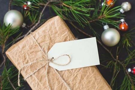 Vintage gift box with label and Christmas decorationsの写真素材