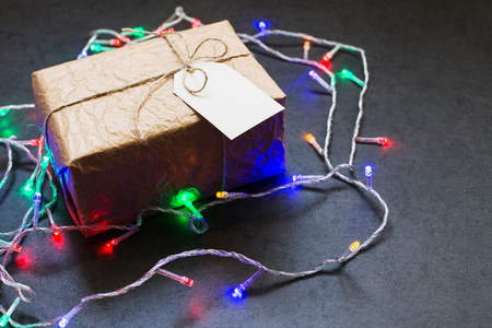 Vintage gift box tied with rope on a gray stone background, shot at angleの写真素材