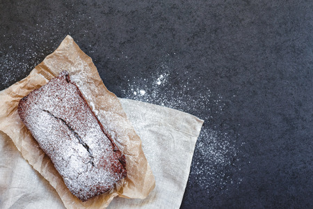 Chocolate cake on baking paper with linen napkinの写真素材