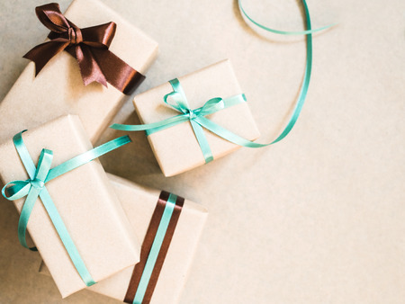 Holiday background with gift boxes wrapped in craft paper. Close up.の写真素材