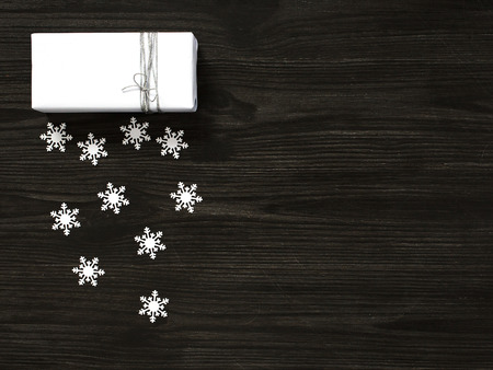 Christmas background with white gift box and snowflakes