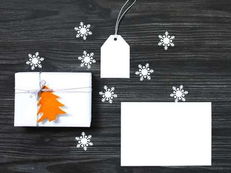 Christmas mock up with greeting card, tag and gift boxの写真素材
