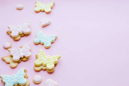 Colorful homemade cookies-butterflies on pink backgroundの写真素材