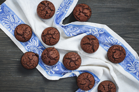 Tasty brownie with linen napkin on wooden tableの写真素材