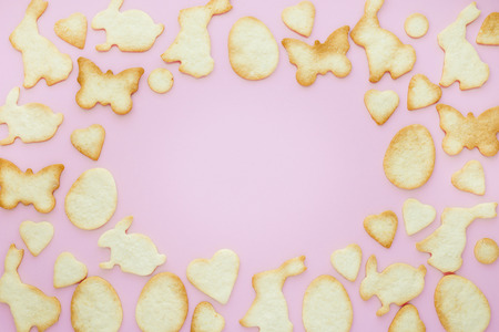 Frame of Easter cookies on pink backgroundの写真素材