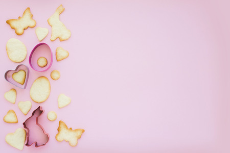 Easter cookies with forms on pink backgroundの写真素材