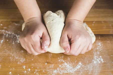 Hand kneading a dough.の写真素材