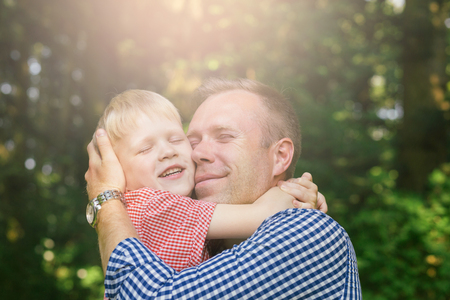 Father and son hugging.の写真素材