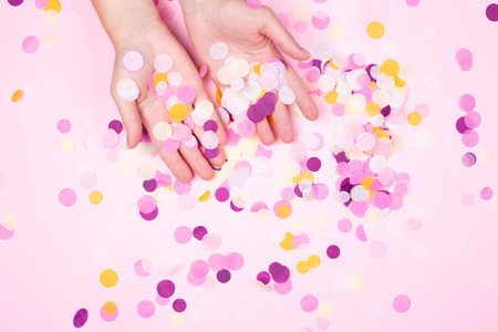 View from above onhands with confetti.の写真素材
