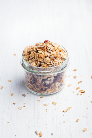 Granola in jar on the table.の写真素材