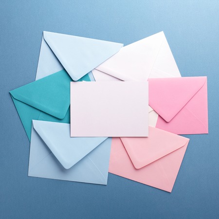 Colorful envelopes on grey table.の写真素材