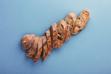 Fresh french chopped baguette on the table.の写真素材