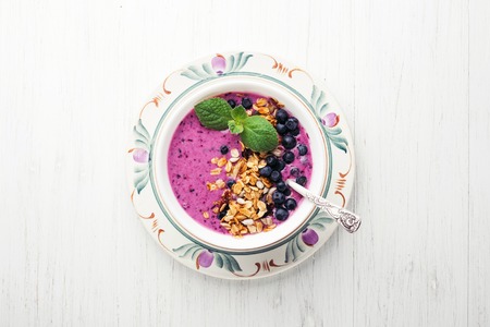 Smoothie bowl with granola and berries.の写真素材