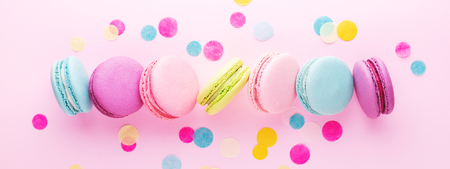Colorful sweet macarons with confetti.の写真素材