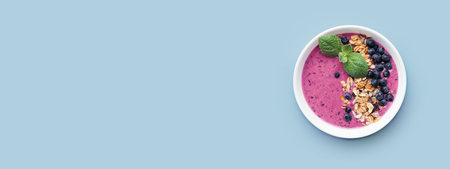 Smoothie bowl with granola and berries.の写真素材