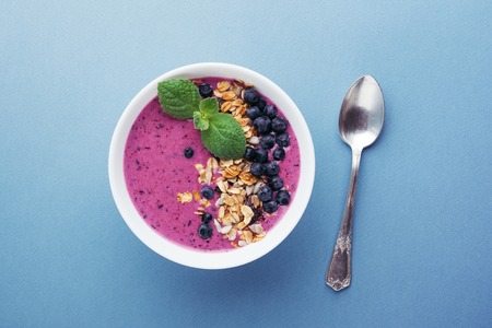 Smoothie bowl with granola and berries.の写真素材